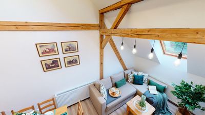 The living area with a sofa and hanging lights