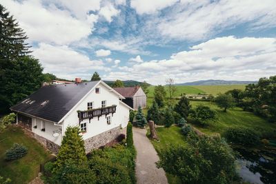 The house, the garden and the meadows behind it, seen from above