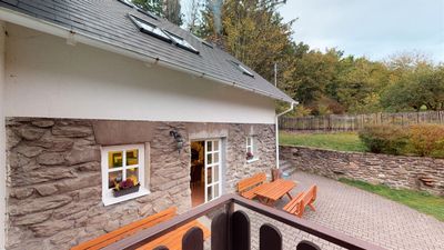 Window and bench against the stone wall of the house