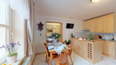 The dining corner, with the kitchen units behind