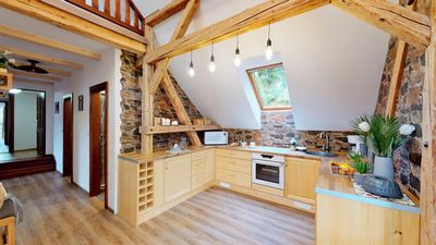 The kitchen by the stone wall under the open roof