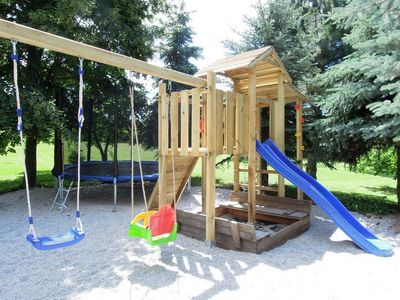 Swings, a slide and a sandpit in the garden