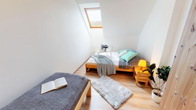 A bedroom with a roof window