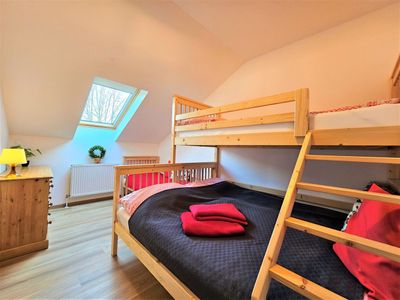 The bedroom with a bunk bed and a double bed