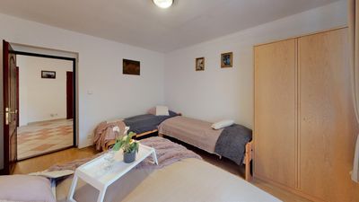 A bedroom with a wardrobe and a single bed