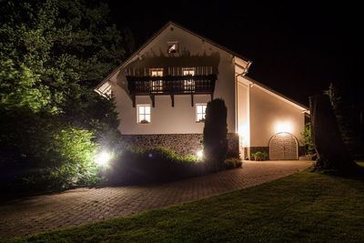 The house lit up after dark