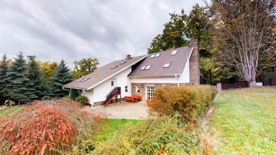 The house from the garden, with autumn shrubs