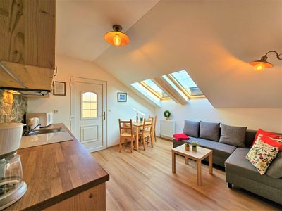 The kitchenette and living area under the roof windows