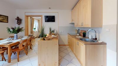 The kitchen with a breakfast bar and dining corner